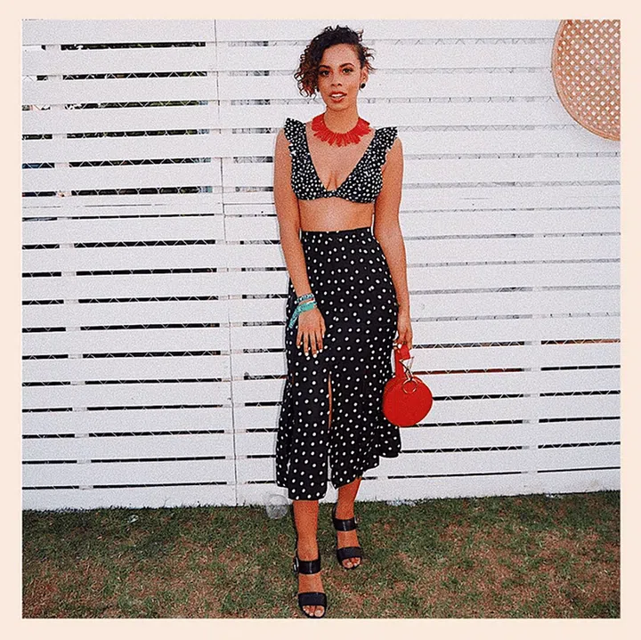 While this skirt could become office appropriate, it's desert-worthy paired with bold red accessories and a coordinated bra top.

Shop it: Rixo London skirt, $278, farfetch.com.