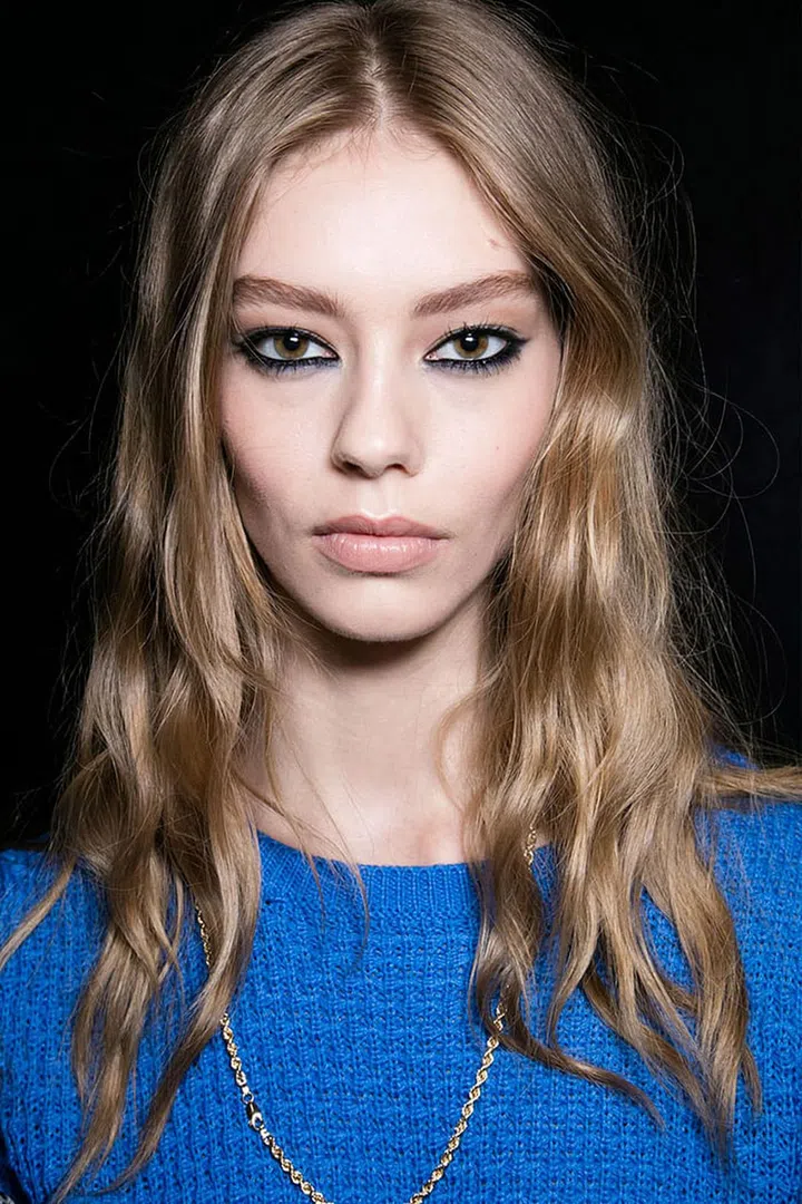 There are only two things you need your eyeliner to be this season: black and greasy. When it comes to technique, it's a free-for-all. Stay safe with a classic flick, as seen at Nicole Miller, or a soft smudge; go for the piercing stare of a Versace girl (left) by rimming your waterlines in ink; or take a dramatically dark turn and don't stop 'til you hit the brow. Photo: Imaxtree