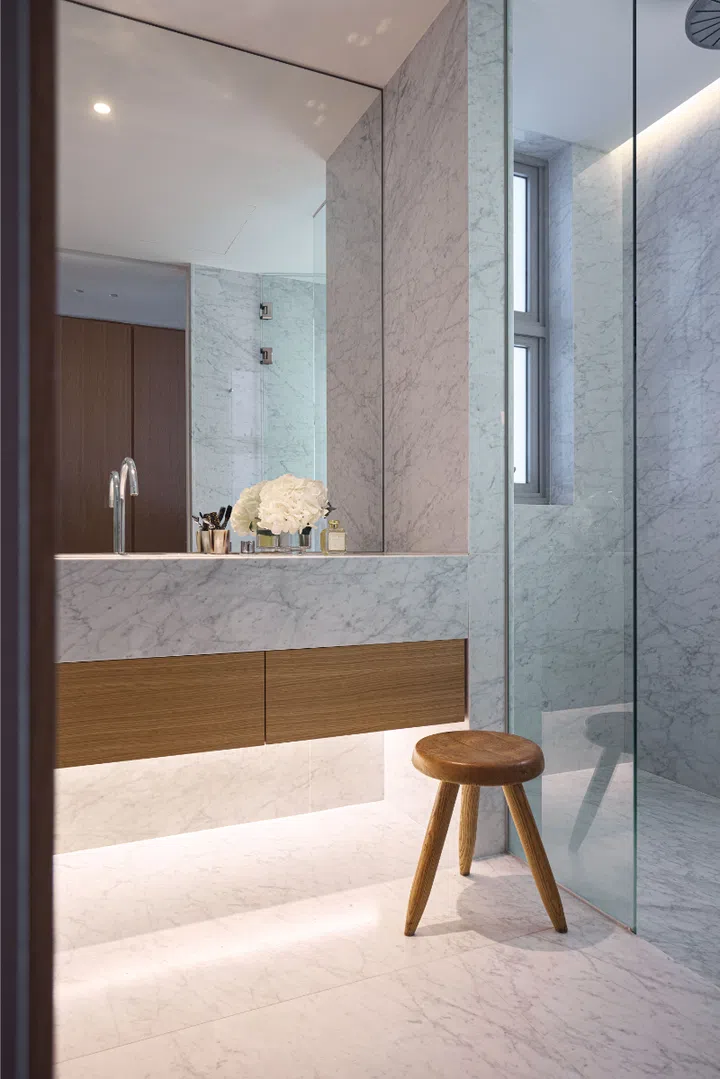 A Charlotte Perriand stool takes pride of place in the master bathroom.