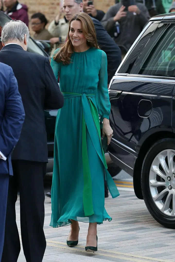 The Duke and Duchess of Cambridge met with the Aga Khan, a spiritual leader and Imam of the Shia Imami Ismaili Muslims, in London. Kate Middleton sported a chic teal long-sleeve dress by Aross Girl x Soler for the occasion and accessorized with dangling ceramic earrings, a deep green velvet clutch, and matching pumps.