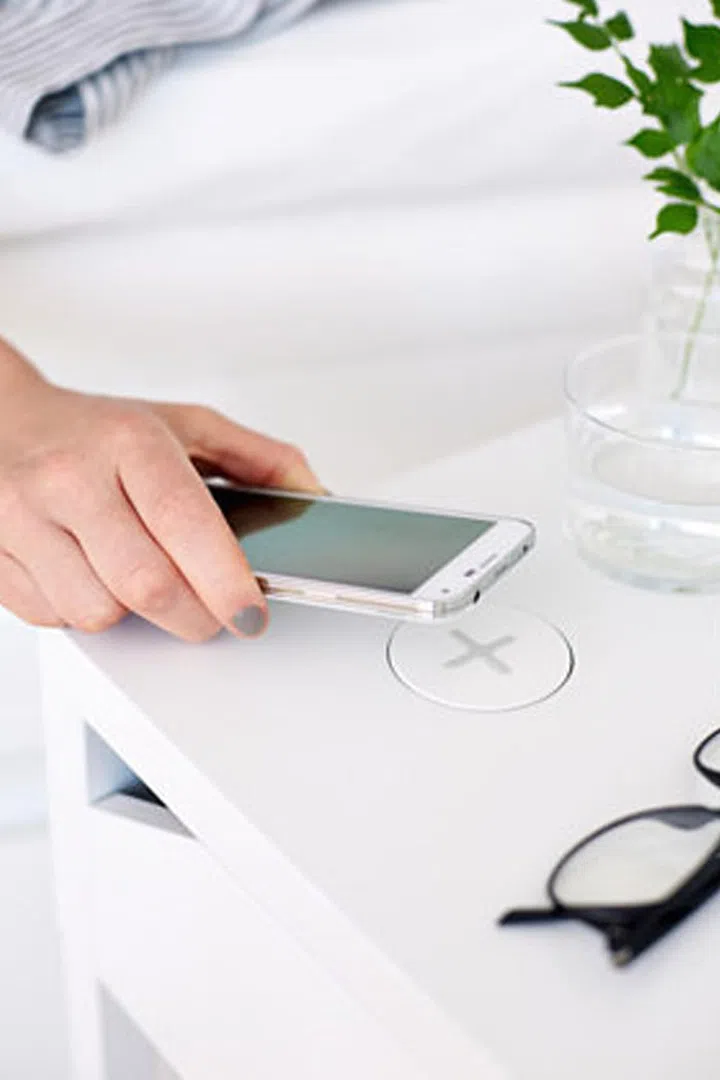 As our lives revolve more around our devices, so will our homes. "We will be seeing more and more creative ways of incorporating charging docks and areas specifically dedicated to these devices into the design of a space," says designer Warren Sheets. IKEA's SELJE nightstand is just one example of the new generation of smart furniture.