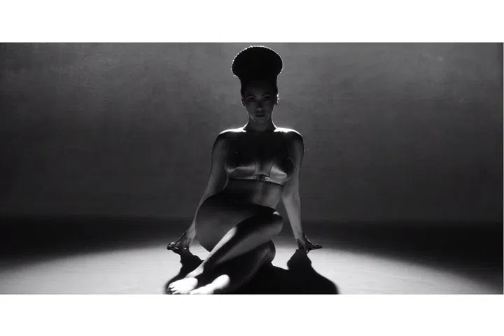 In a Zana Bayne bra and Maxior earrings. Photo: HBO