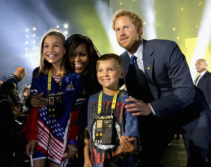 Prince Harry, 31, with Michelle Obama at the opening ceremony of the third Invictus Games in Orlando.