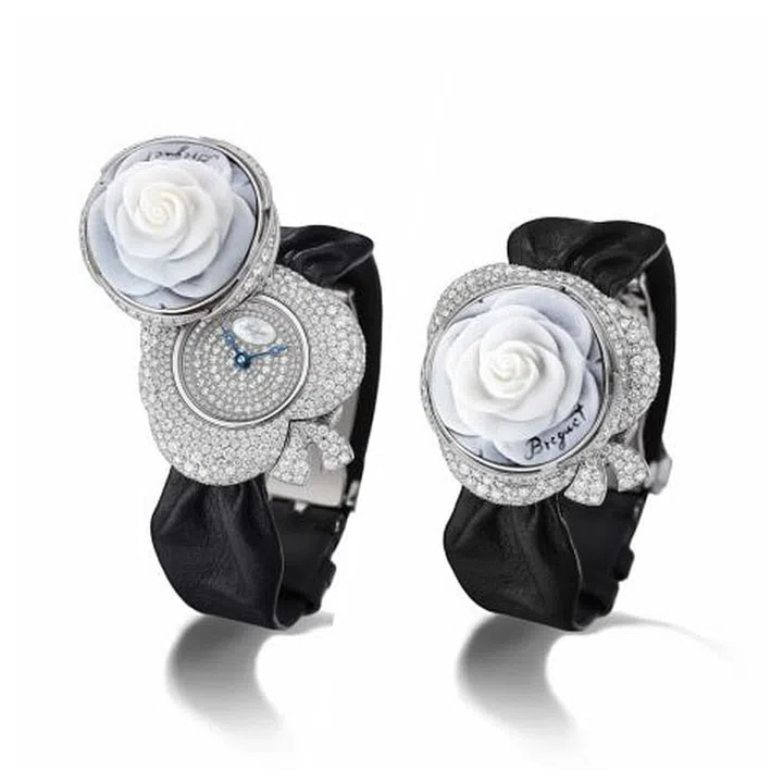 A rose by any other name would smell as sweet…but can it also tell time? A self-winding mechanical movement is placed under a fully sculpted bloom, a watch made out of mother-of-pearl and white gold featuring 573 diamonds (3.6 carats in total) on the case, dial, and even the clasp. 
$92,200. breguet.com