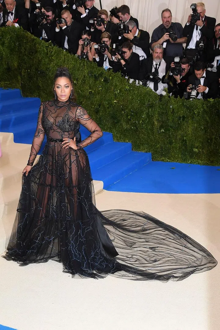 La La hops on the sheer black gown train with this beautiful beaded number. It has the glamorous effect of a traditional red carpet gown with a touch of sexiness from the sheers. Photo: Getty 
