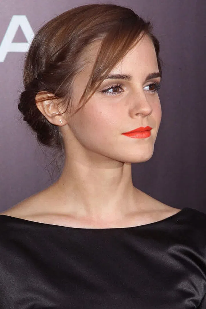 Another great way to disguise long bangs? Twist and fold them into your hair.