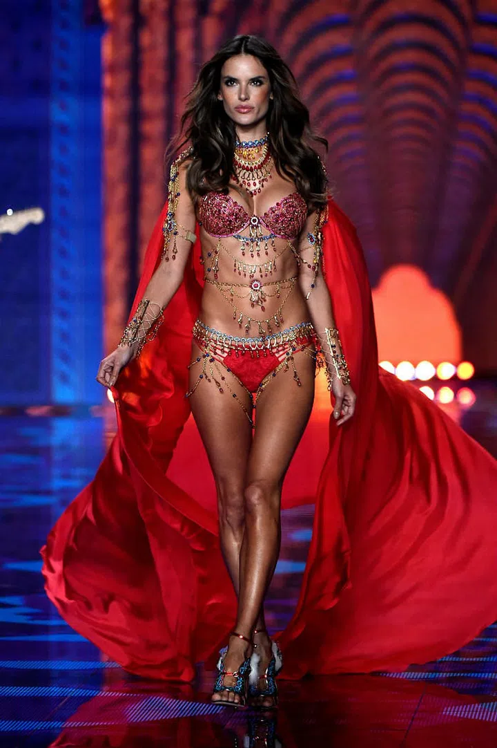 A stark contrast from the previous image of coolness, Alessandra brings the image of a red hot queen to life in this bejewelled number, which also happens to be one of the two Fantasy Bras that were featured in the show (Photo: Getty)
