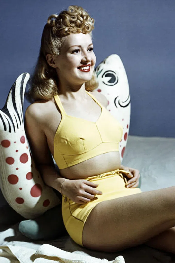 Take note from Betty Grable's beach style with a bright retro bikini set.