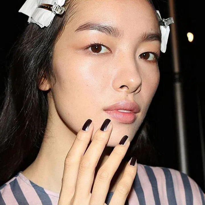 INSPIRED BY: Vera Wang Spring/Summer '17.
WHY WE LOVE IT: High-shine black polish is making its mark as 2017's best nail accessory. Whether vertically striped (as spotted at Vera Wang), curved around the cuticle, or painted at the tips—it's a simple but bold look that appears equally chic when painted over bare nails or alongside vibrant pops of color. 
