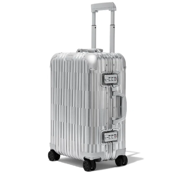 Christmas gift guide 2024 travel fashion Rimowa optical cabin luggage bag