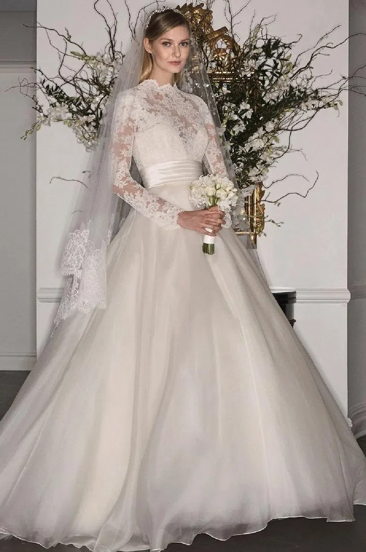 Romona Keveza is another designer known for classic silhouettes with a twist. Her Legends range, which channels the look of style icons throughout history at an affordable price point, is a constant source of chic classics. This mock neckline organza and lace gown feels evocative of Pippa's look, with a softer fabrication.

Legends by Romona Keveza gown, legendsromonakeveza.com