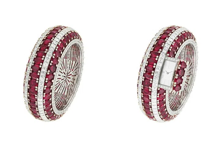 Shhhh. It's a watch! A mind-blowing batch of 115 Mozambique rubies make up the Rubis Secret watch from Van Cleef & Arpels. Cleverly hidden inside the bangle bracelet is a tiny side drawer that pops open to reveal the time. 
Price Upon Request. vancleefarpels.com
