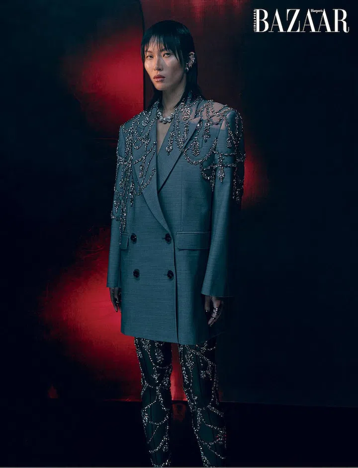 Jacket; stockings; earrings; necklace; rings, Alexander McQueen (Photo: Paul McLean)
