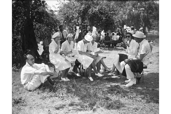 British Olympic women's fencing team having lunch on the lawn prior to the opening ceremony of the 1948 London Olympics. The A-line skirt becomes popular for women's female uniforms. Photo: Getty

