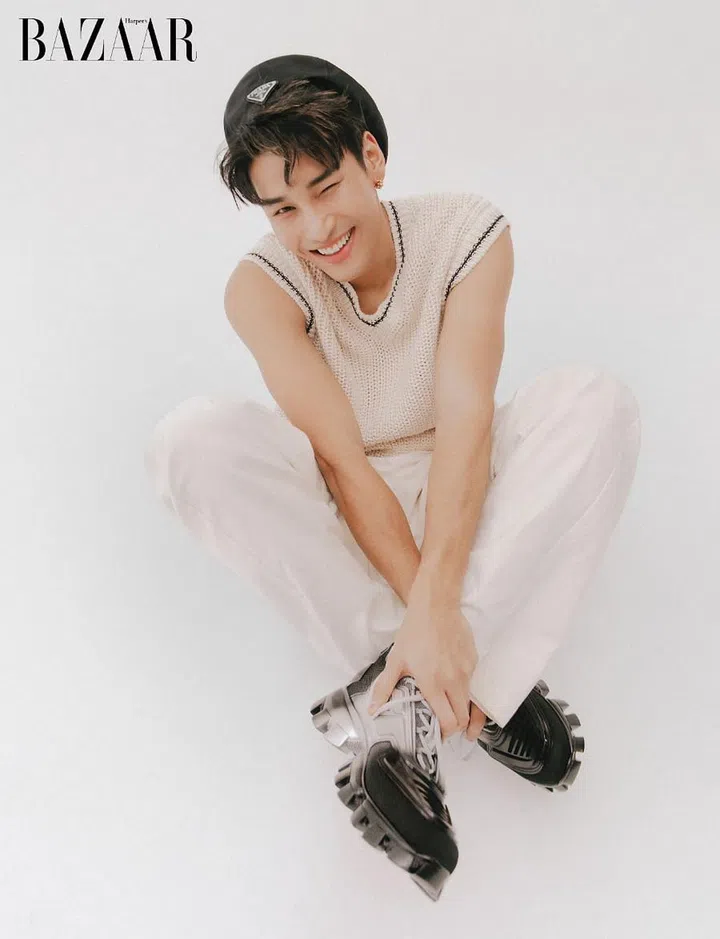 Sweater vest; trousers; beret; sneakers, Prada. Earring, Cartier.