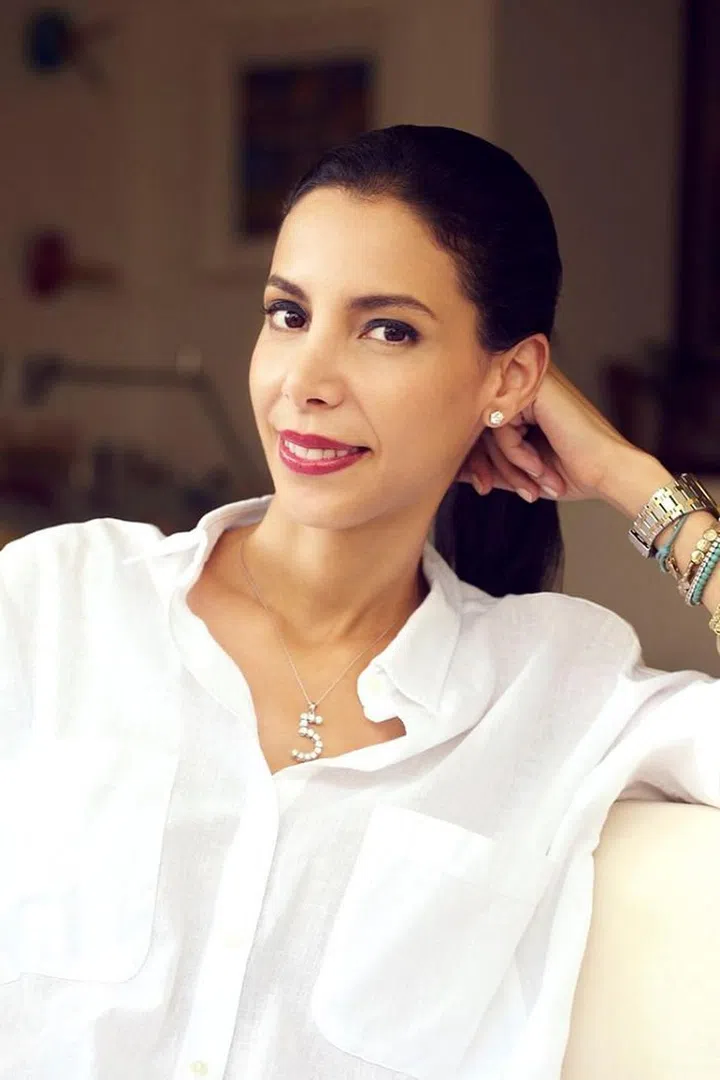 “I think the most important thing is to keep it real and be yourself. It's already hard enough to convey who you are in a video call when you’re dealing with bad connections and other technical difficulties, so it's not the best time to be experimenting on your fashion choices. I personally like to stick to my signature jeans and white top combo. I also like to add in a few accessories. Big earrings are great as they frame your face and help distract from things like dark circles and blemishes. In regards to makeup, I like to keep it simple but always wear a little blush, concealer, and a touch of lipstick to help combat poor lightening which can make you look dull on camera. Last but not least, make sure your backdrop is clean and organized. I know people are enjoying playing with different backgrounds on certain platforms, but I find them distracting and have even seen them distort the shape of your head, which is not a good look.”

Photo: Courtesy