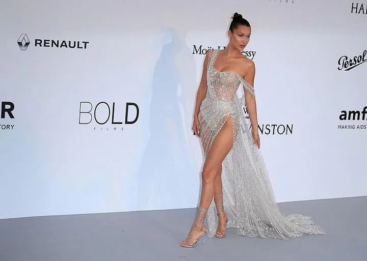 Winning the how-naked-can-you-be-in-public game was Bella Hadid in her audacious Ralph & Russo gown. The one-shoulder creation was entirely sheer, bar the scattered beading, and the model wore nude underwear to preserve her modesty. Photo: Getty 