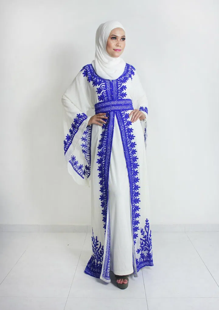 This charming number is a great layering piece that will get all the attention with its beautiful embroidery and striking colour. Photo: Lulu Al Hadad