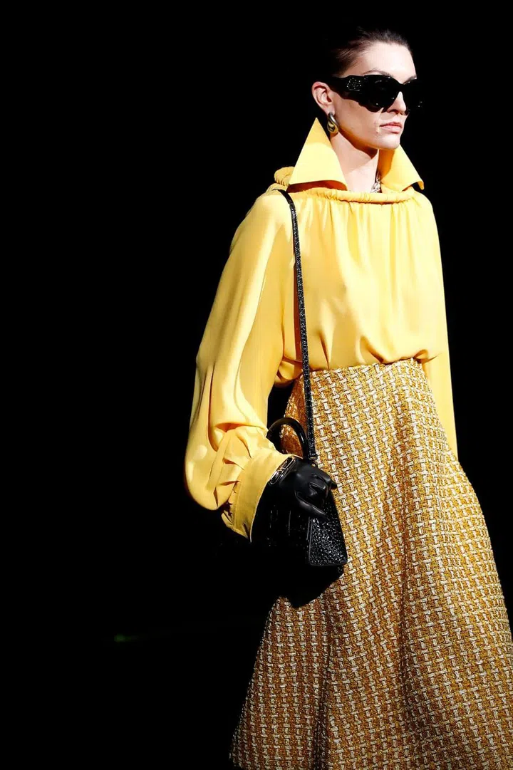 After the grandiose sets of the past couple of seasons—the psychedelic tunnel, the graffiti snow mountain—Demna Gvasalia pivoted to something a lot more minimal this season. The collection reflected this shift, opening with streamlined tailoring for both men and women—no outrageous Instagram fodder here; instead, a grown-up proposition of clothes meant to be worn on the streets. To underscore this, Gvasalia laid his set with fresh asphalt—even though this was hardly visible from the runway images alone. Equally subtle were the minute manipulations signalling the technical mastery that went into the collection, such as shoulder seams sculpted and pinched to stand away from the body. Other quietly inventive details included circular hoop necklines, lapels extended to the ears, buttonless blazers, and hoodie-shawl hybrids—the last a particularly clever take on an established Gvasalia signature.