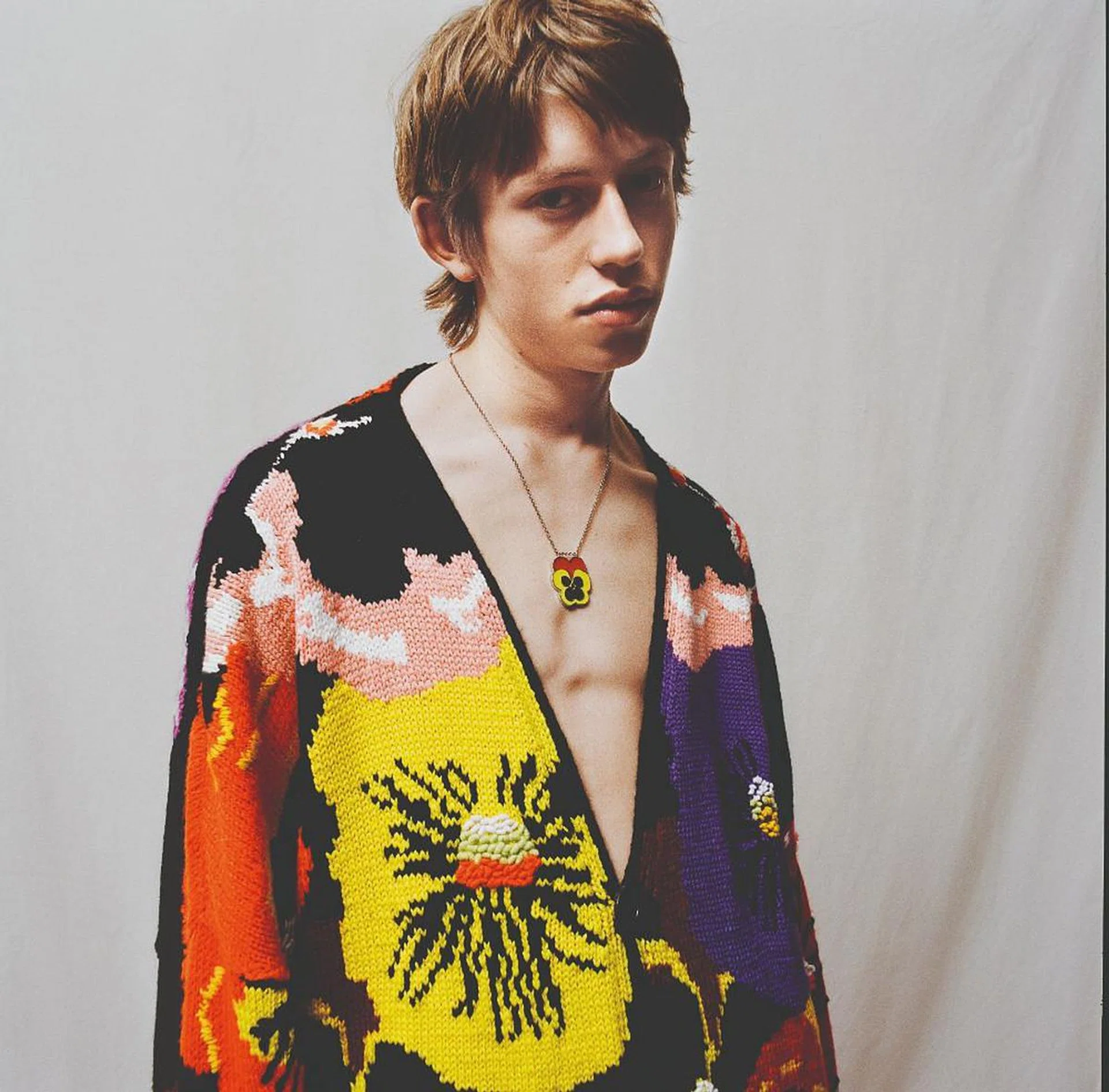 A look from the fall/winter 2021 menswear collection featuring a motif of pansies inspired by the works of Joe Brainard (Photo: LOEWE)