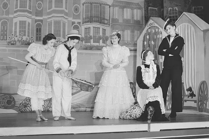 From 1941 to 1944, Princess Margaret and then-Princess Elizabeth would put on pantomimes at Windsor Castle. (Proceeds from the performances went to the Royal Household Wool Fund, which went to supply wool to make comforters for soldiers stationed during World War II.) In 1944, they performed "Old Mother Red Riding Boots." How cute is that set?