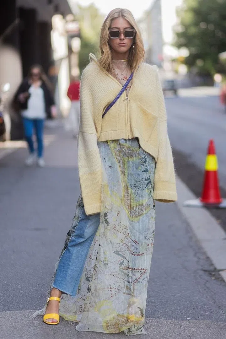 As well as allowing you to wear your summer dresses for longer, the trend will let you to bring some of your eveningwear into the day. Take this sheer, floor-length dress which has been made far more casual by pairing it with light-wash jeans and a hoodie. Photo: Getty 