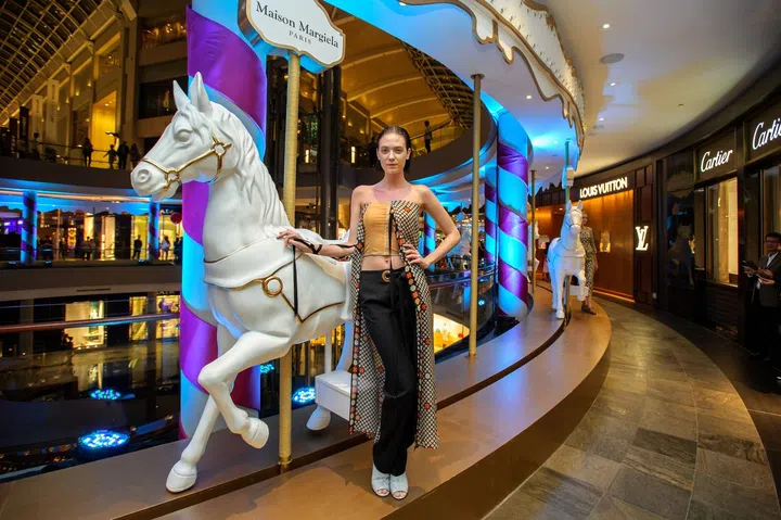 Into the Carnivale Fashion Presentation featuring clothes from Maison Margiela