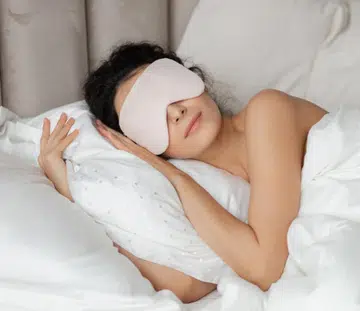 woman sleeping with eye mask