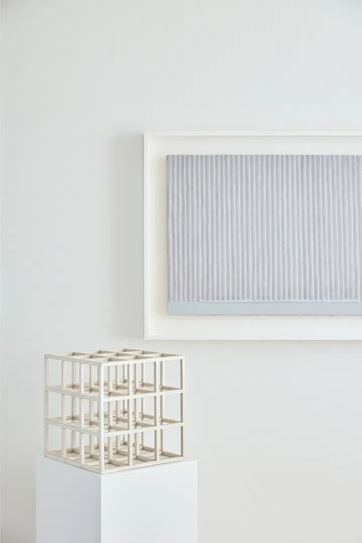 An artwork by Park Seo-bo and a Sol LeWitt sculpture. 
