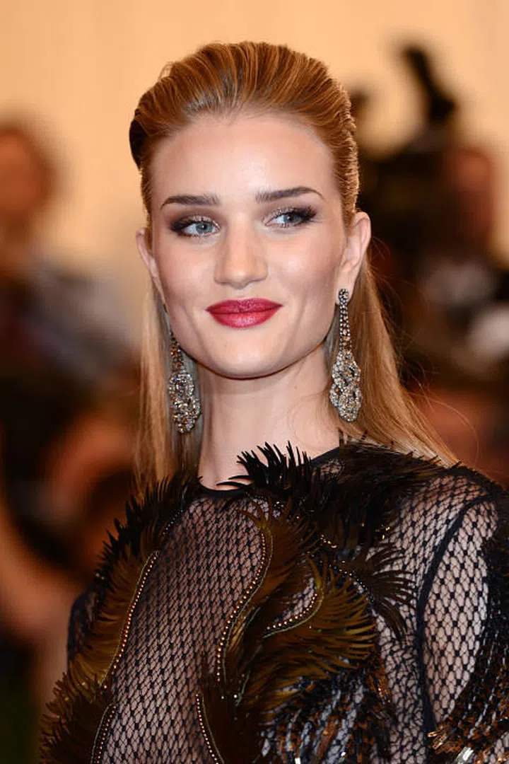The style: The model opted for a sleeker look for the red carpet with a pulled-back half-up half-down style. Photo: Getty