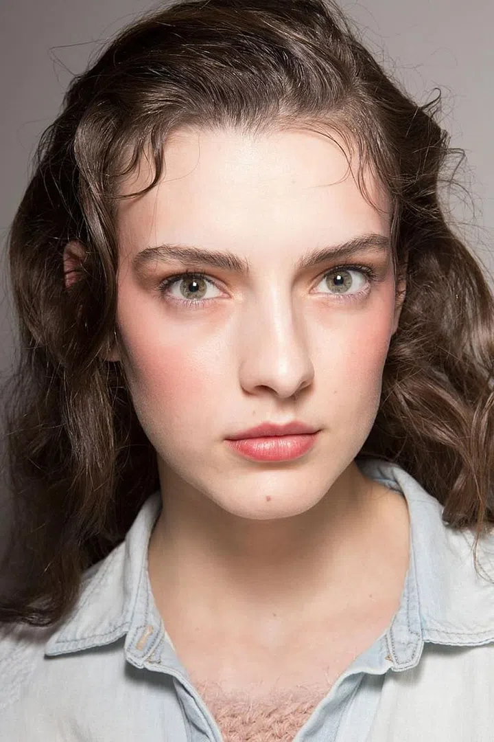 At Nina Ricci, where references ranged from Texas rodeos to '80s glam, it only made sense that the hair would be big and bouncy and tossed to one side.  