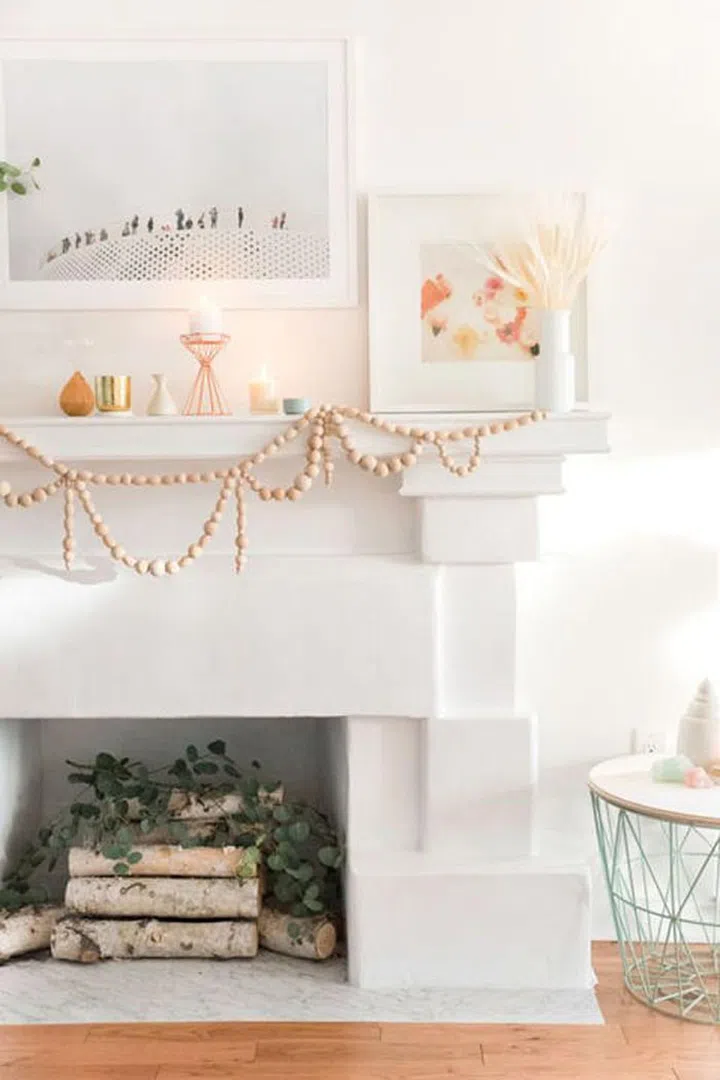 Celebrate the holidays seaside with a rose-colored, wood take on a garland that still feels festive in the sunny weather.