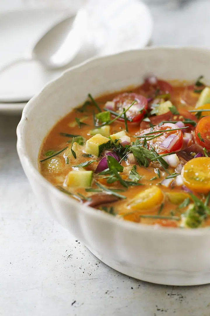 Often vegetable-based, chilled soups contain lots of fiber — a macronutrient that's proven to reduce appetite and total calorie intake, promoting weight loss over time. Because soup is largely made up of calorie-free water, you can consume a large serving — which takes up room in your belly — for a reasonable number of calories. (Depending on the recipe, two cups of tomato-based gazpacho can clock in under 100 calories.)