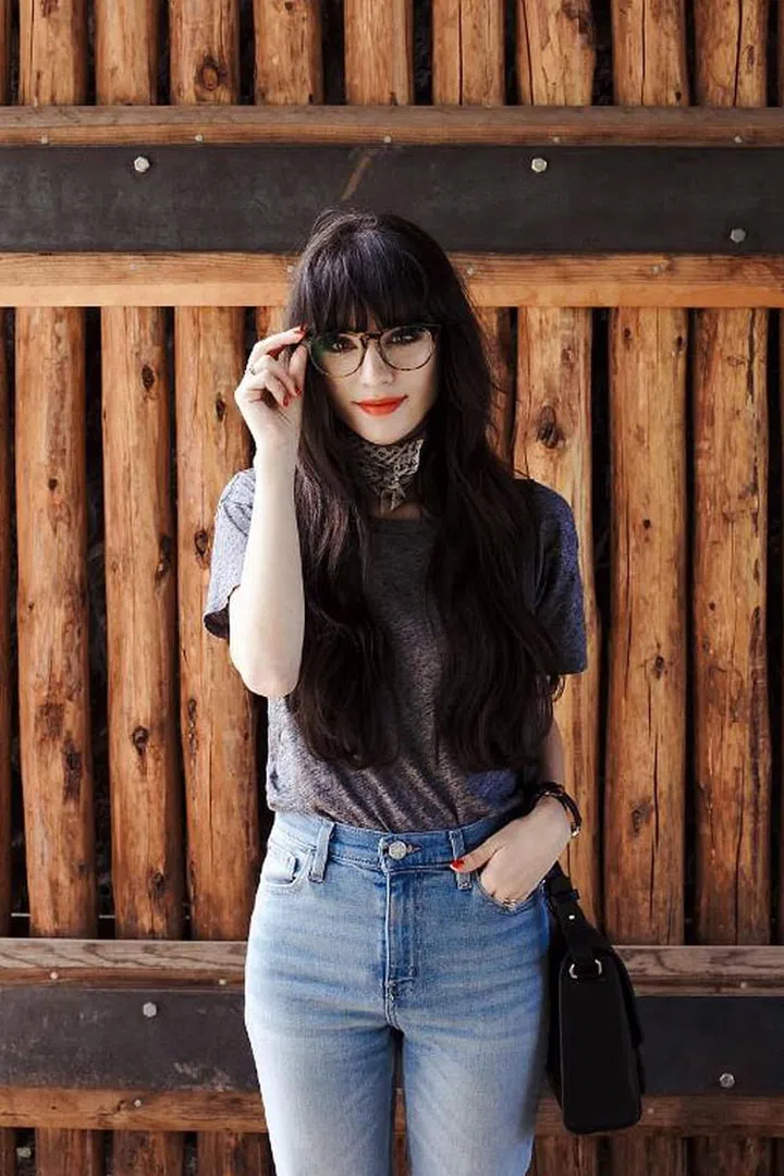 Arizona blogger Christina Martinez is always styling her hair in braids, buns, and twists that highlight just how versatile bangs can be. Photo: Instagram @newdarlings