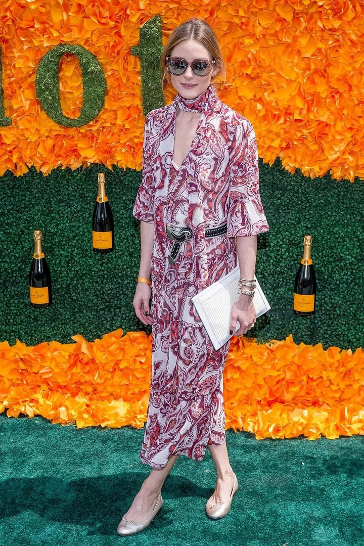 You don't have to wear heels in order to have a street style-winning look. A pair of flats goes a long way, whether in the form of ballet flats or white sneakers. Photo: Getty