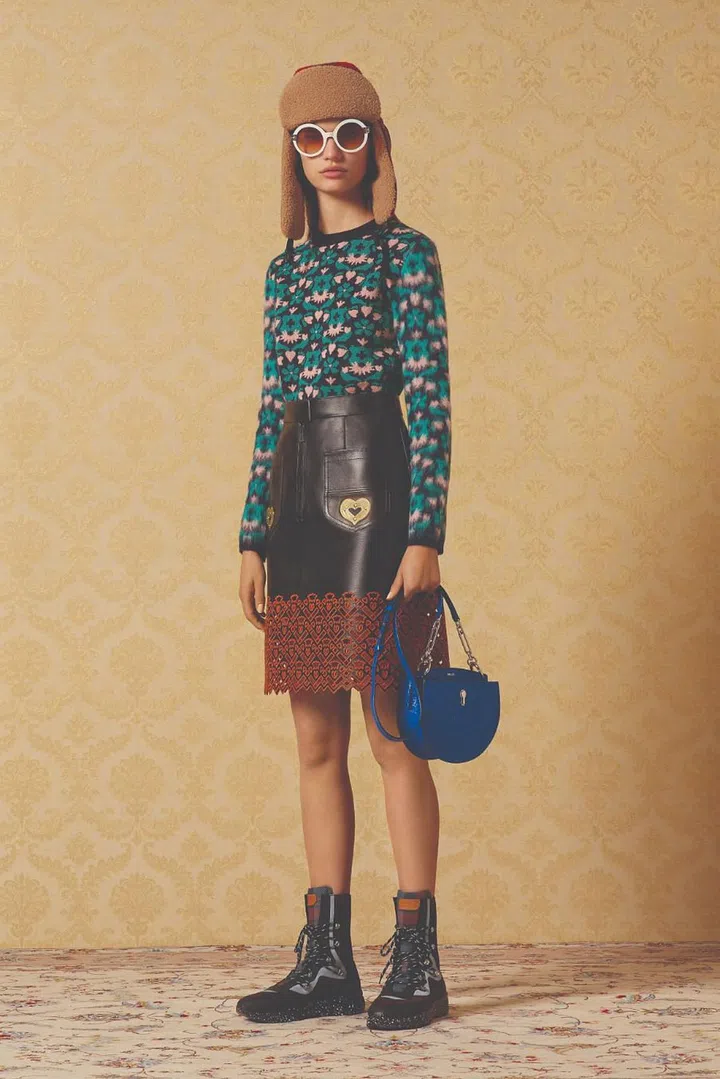 For fall/winter 2019, the Bally creative team dove deep into their Swiss heritage by tapping an archival Alpine logo from the ’50s for inspiration— fitting for a brand famed for its luxurious take on winter basics and technical gear. From the vintage feeling sweaters, to leather ponchos edged with laser-cut lace, to shearling puffers with contrast-coloured zig-zag lining, the collection juxtaposed
cheery brights and sweet sorbet tones against nostalgic motifs like Swiss crosses, old mountain map prints and
pixelated embroidery of tiny skiers. These rustic touches added a charming softness to a collection dipped in ’90s sportswear references. Finely crafted ski and down jackets along with sturdy knits accessorised with chunky climbing boots and shearling winter caps added a
utilitarian note that spoke to contemporary tastes.