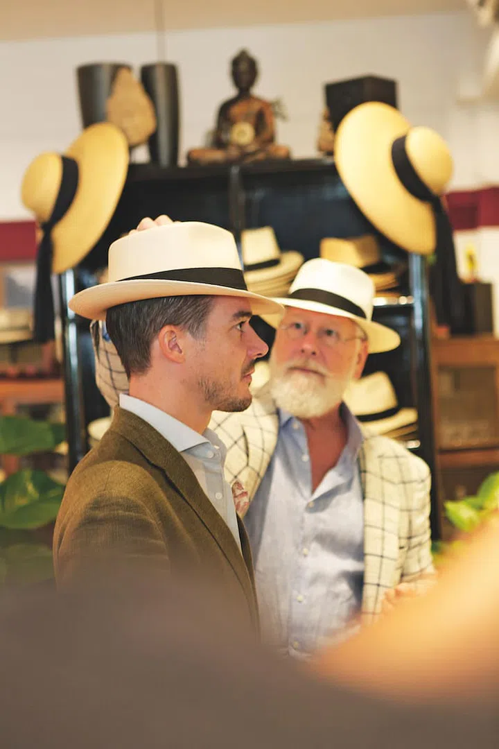 Bill Cain fitting a hat on a customer. (Photo: Bill Cain)