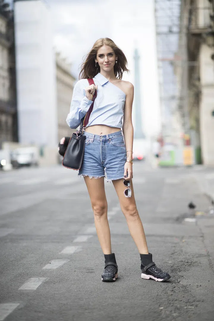 Chiara Ferragni in Dior Fusion high top sneaker in black neoprene embellished with “Constellation” embroidery, pink rubber sole