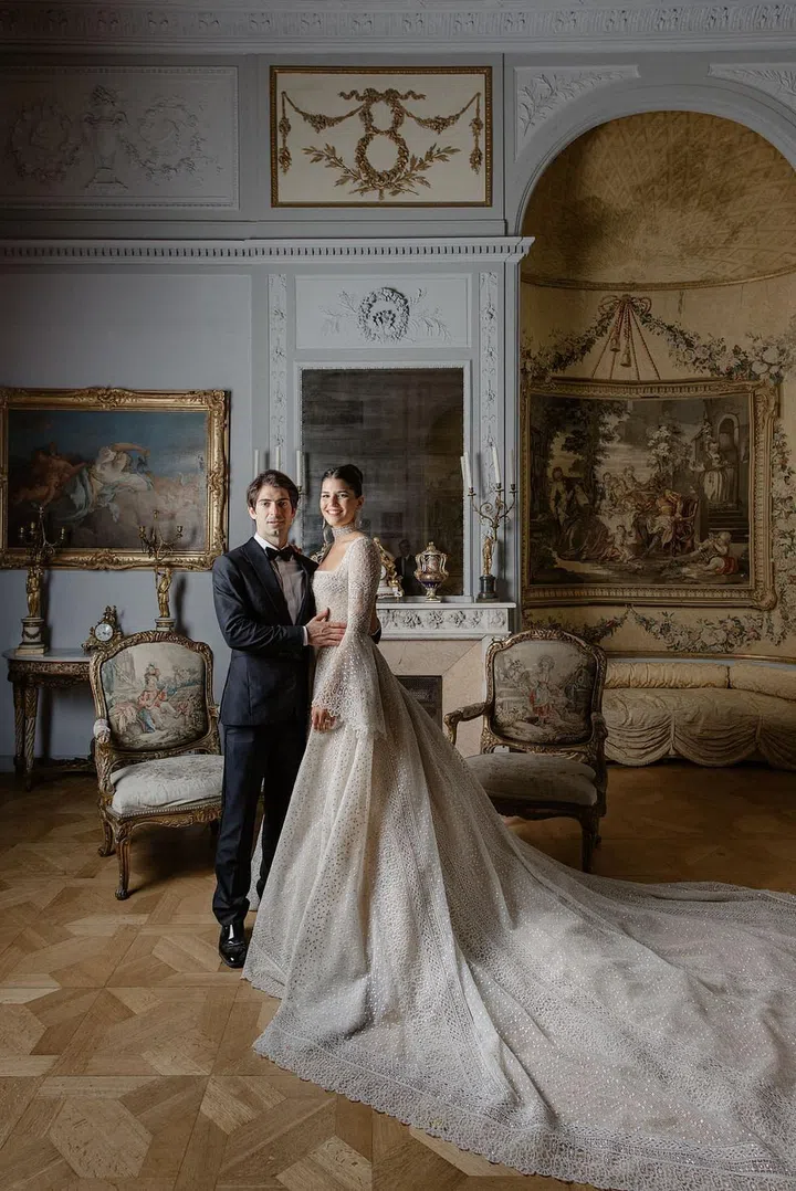 Take a page out of the Royals' wedding handbook and capture some otherworldly photographs in the parlor or ballroom of your venue that you’ll treasure forever. Notable architecture and mid-century decor will naturally make for elegant, picturesque portraits–as will keeping the lighting rich. Consider a Duchess-worthy ball gown, Victorian-inspired neckline, or another fashion-centric detail compliment the regal vibes.

Photo: Getty