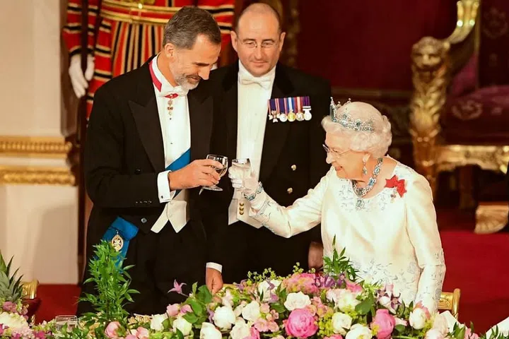 Queen Elizabeth II and King Felipe VI of Spain toast at the State Banquet at Buckingham Palace in London.