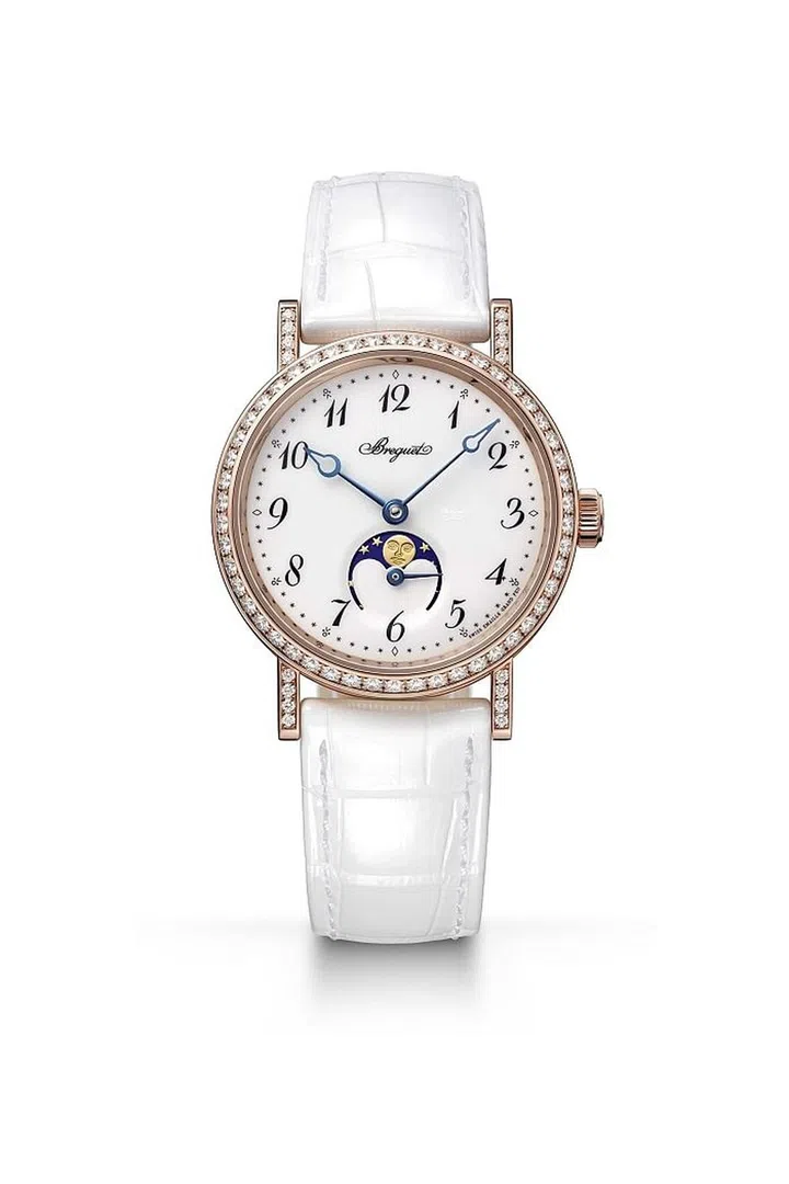 A lovely white dial surrounded by diamonds is surprisingly unfussy, but inside lies a powerful mechanical watch with a 45 hour power reserve featuring a phases of the moon and small seconds indicator. <b>Breguet, $28,200</b>
