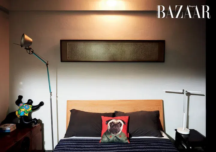 A calligraphy scroll from his grandfather hangs on the wall of the guest bedroom.