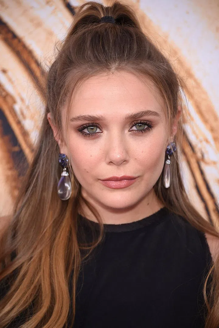 The new half-bun is the half-up—but make it high for the most modern feel.