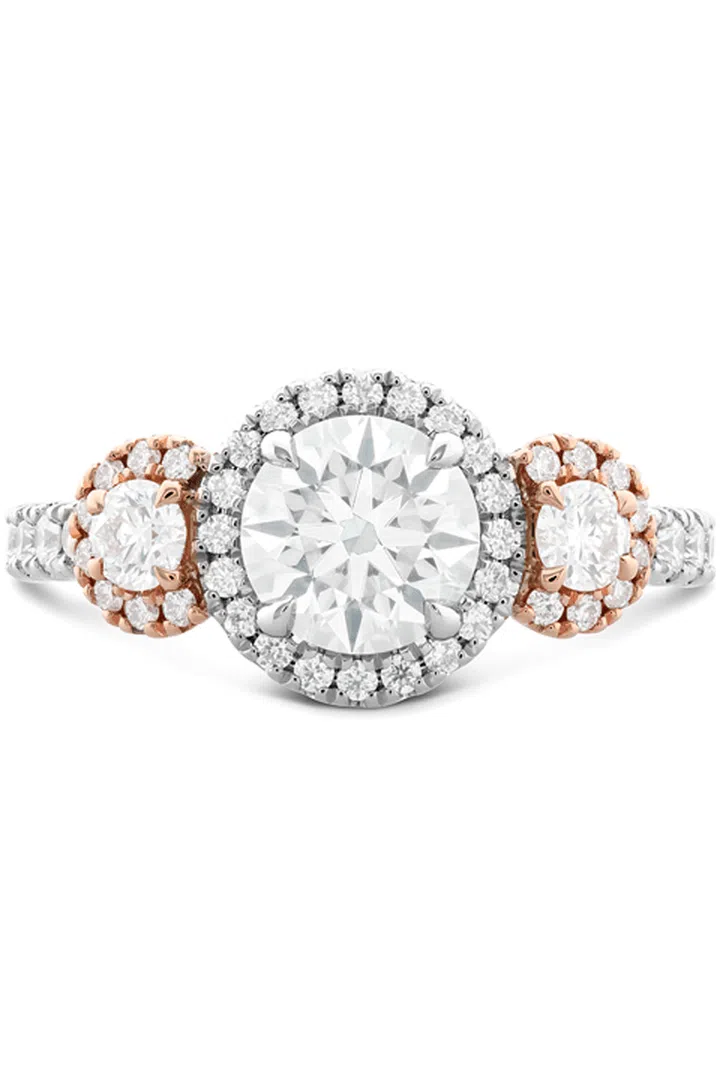 Your ring has: Three matching cut stones and a mixed-metal setting
You are: Anything but boring. You go for the classic simplicity of three similar-cut stones, but take it up a notch with a mixed metal setting. "You can't resist what's in style right now," Sabatino says. Your friends consistently ask you for fashion advice, and your love of what's coming straight off the runways means your closet is extremely well-stocked.

Integrity Hearts on Fire Three Stone Engagement Ring, heartsonfire.com.

Photo: COURTESY OF HEARTS ON FIRE