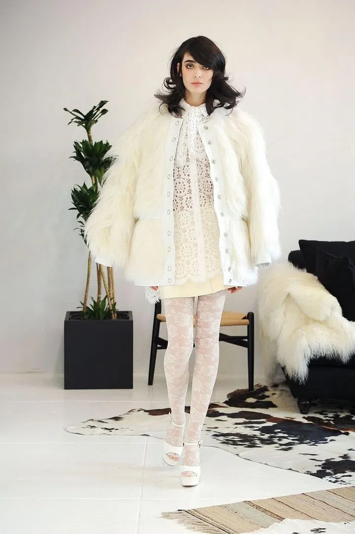 Inspired by style icons Katharine Hepburn, Bianca Jagger and Patti Smith, this line is the epitome of laid-back luxury. Designer Katharine Polk's bridal collection seamlessly transitions into her ready-to-wear offerings, creating pieces worth wearing more than once and bridal separates that allow for some styling freedom and post-nuptial mixing and matching. Houghton's bridal outerwear like a satin bomber with "Not Your Baby" artfully emblazoned on the back and a wide range of fur toppers separate this line from the others offering separates. A variety of easy-to-wear silhouettes will attract the bride who is turned off by corsetry, ballgowns and sweetheart necklines. One visit to their New York City studio or one of their many nationwide retailers and brides in the know will get it: Polk designs clothes brides want to wear.