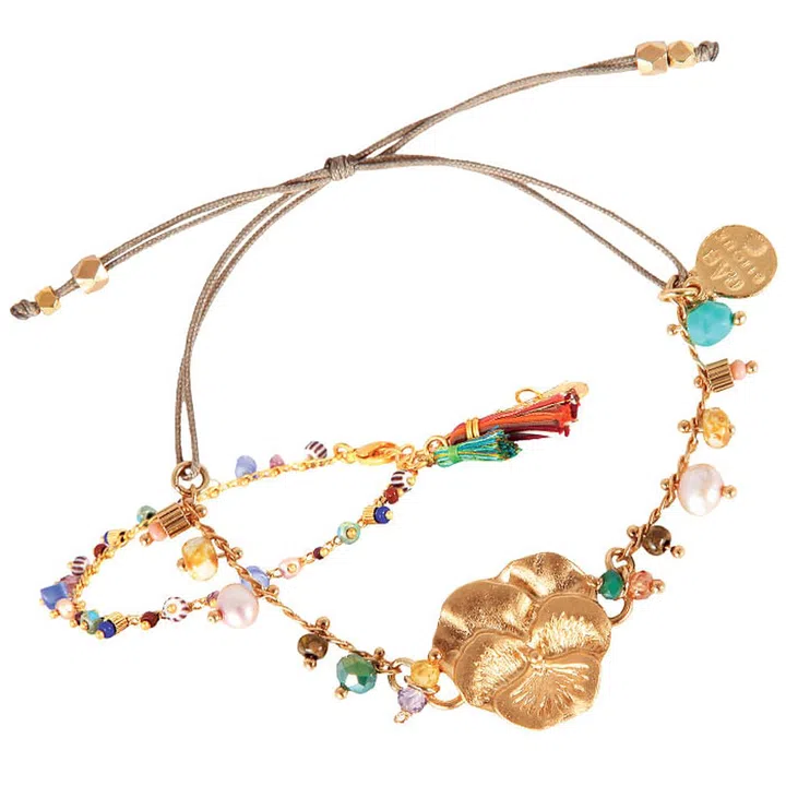 Easy does it with a rainbow of polished stones and nature-inspired motifs, finished with tassels that
sway with every stride.