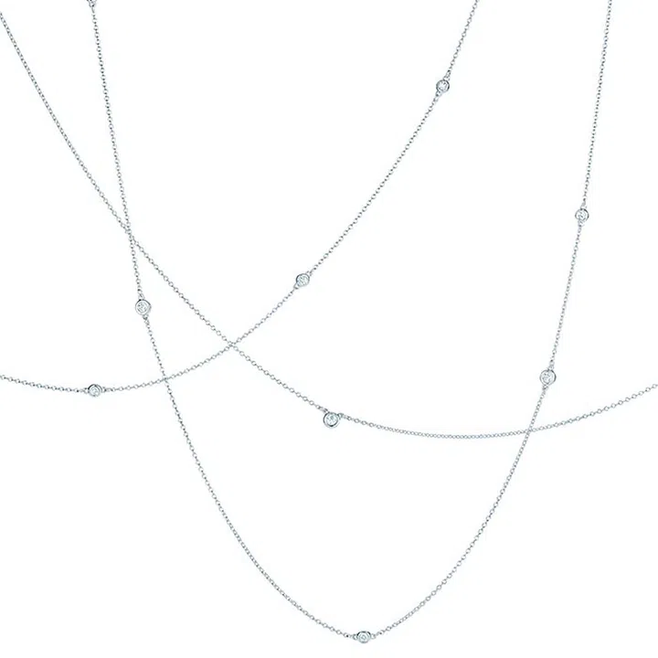 Simple and clean, this reinvented diamond necklace not only falls on your body sensually, it glows against the skin.