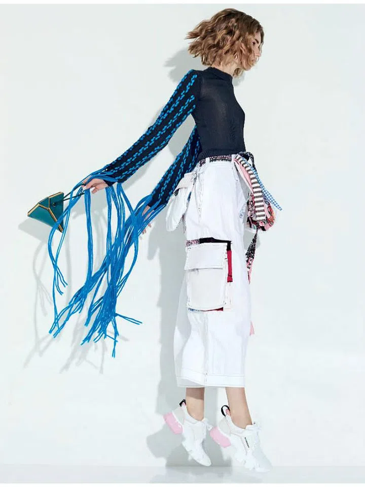 Knit Top, Loewe. Bag, Bottega Venetta. Sneakers, Givenchy.