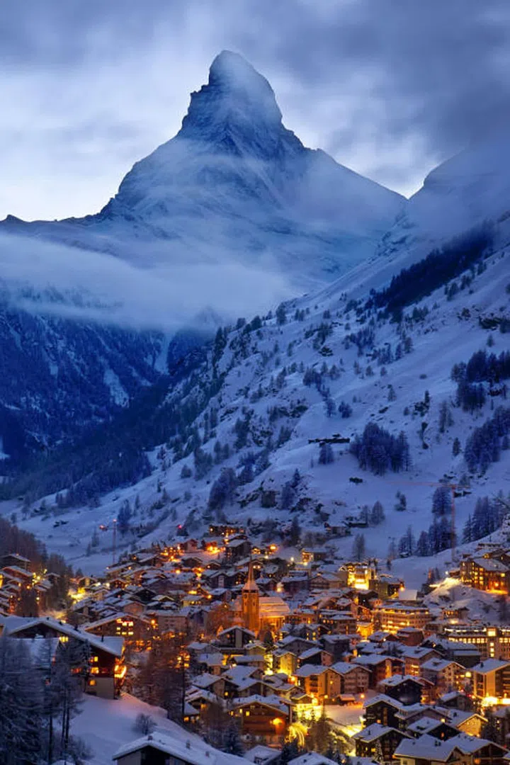 The Swiss Alps are the ultimate winter honeymoon destination—especially for couples who love to ski and dine on rich, decadent Savoyard cuisine like raclette and fondue. Photo: Getty 