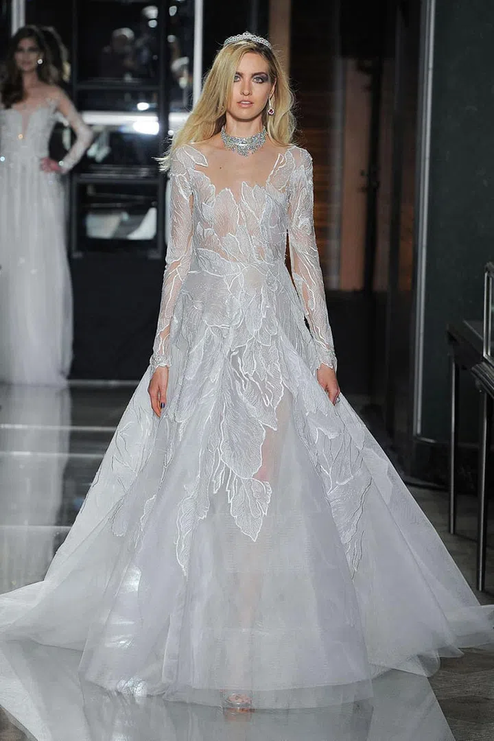 Natural motifs like leaves, wheat, florals and grasses, feel apropos for countryside celebrations. Reem Acra gown, reemacra.com. 